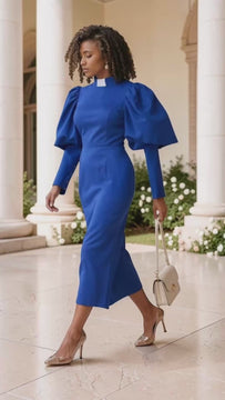 Royal and white clergy dress with puff sleeves and a classic collar shown walking outdoors by Tally Taylor.